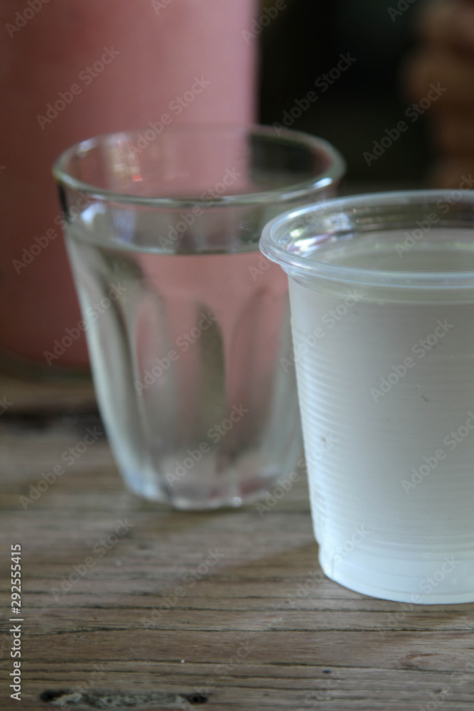 Cool drinking water in a clear plastic glass. Cool drinking water in a clear plastic glass.