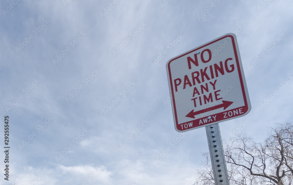 No parking anytime sign against the sky with plenty of copy space. No parking anytime sign against the sky with plenty of copy space.