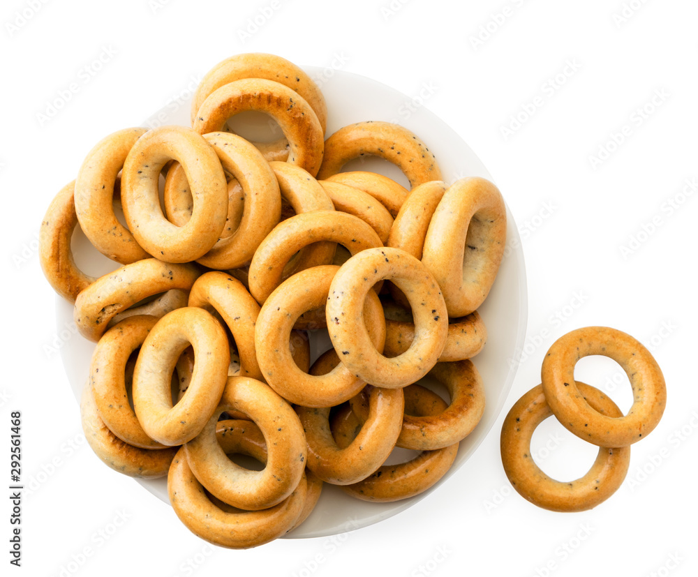 Bagels in a plate on a white. The view of the top.