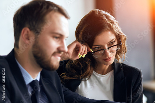 cute clever awesome woman touching her glasses thinking about suggestion, offer during the meeting, confedent pleasant woman controlling her colleague's work, close up photo photo