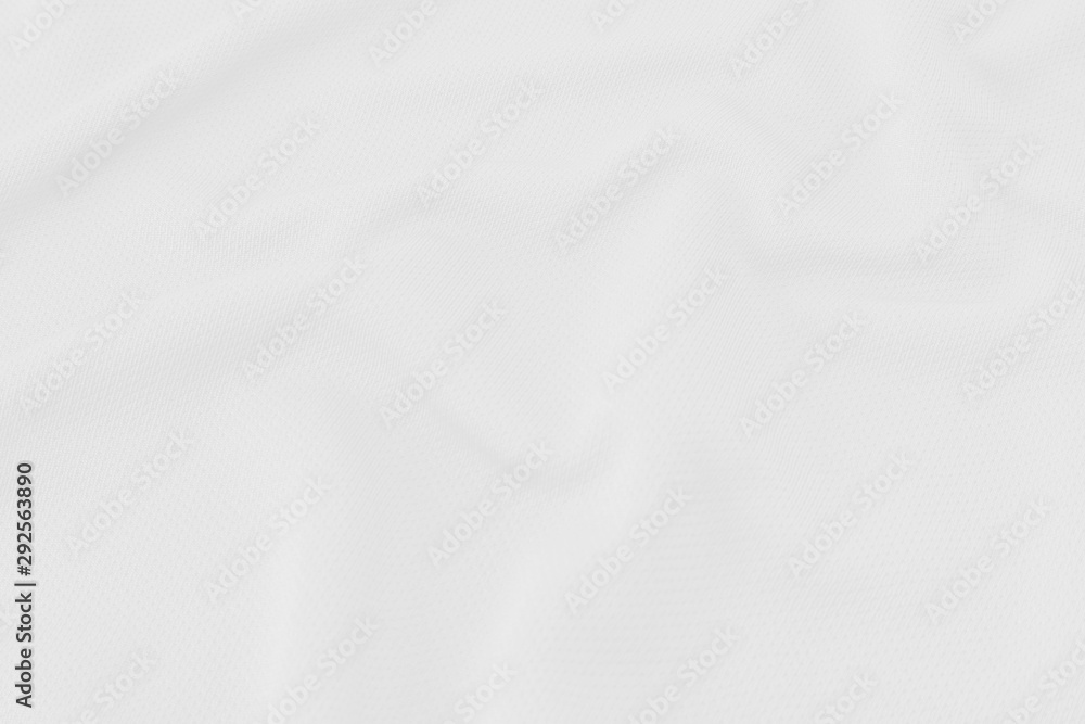 White fabric texture background with soft waves.