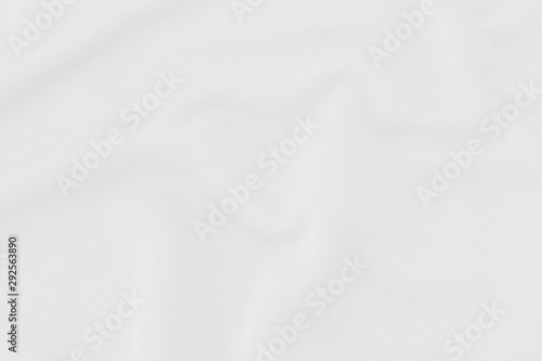 White fabric texture background with soft waves.