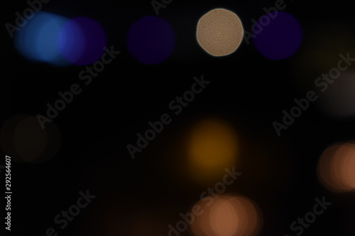 Dark and Bokeh light of orange, red, blue,  coourful light  for abstract background photo