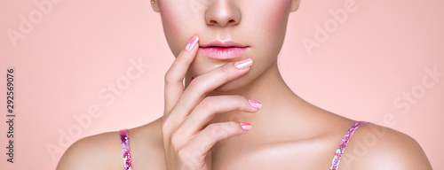 Beauty Woman with perfect Makeup and Manicure. Pink Lips and Nails. Beauty girls Face isolated on light Background. Fashion photo