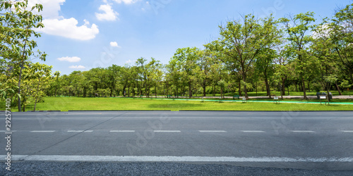 Empty highway asphalt road and beautiful sky in landscape green park photo