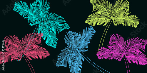 Palm trees silhouettes on the sea coast