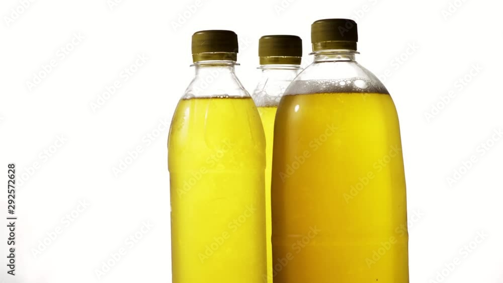 amber beer in three plastic bottles on a white background for Oktoberfest celebration amber beer in three plastic bottles on a white background for Oktoberfest celebration