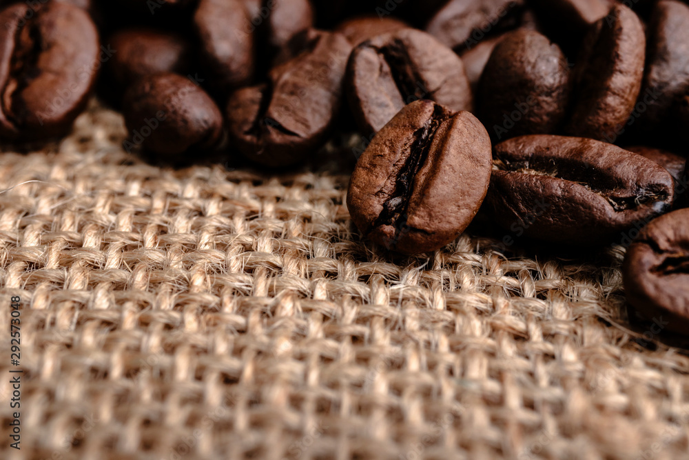 Coffee beans on burlap background Coffee beans on burlap background