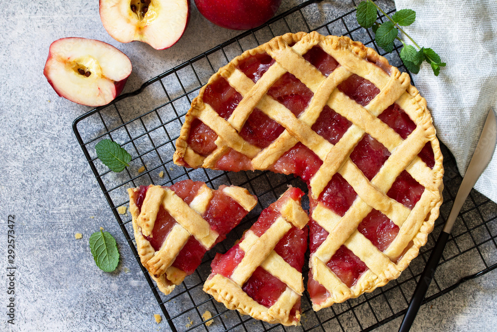 Homemade baking. Autumn apple pie on a light stone or slate table. Top view flat lay. Free space for your text. Homemade baking. Autumn apple pie on a light stone or slate table. Top view flat lay. Free space for your text.
