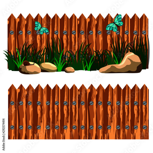 fence with grass, stones, and butterflies