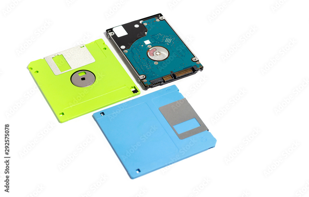 The difference between storage devices. Old technology of floppy disk and new technology of hard disk. isolated on white The difference between storage devices. Old technology of floppy disk and new technology of hard disk. isolated on white