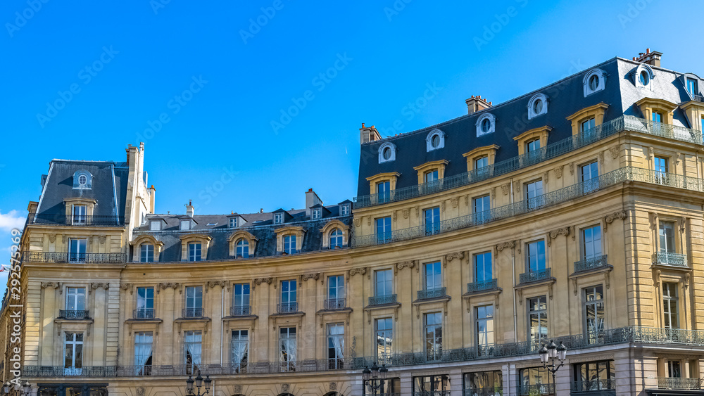Paris, France, beautiful buildings place des Victoires, typical parisian facades and windows