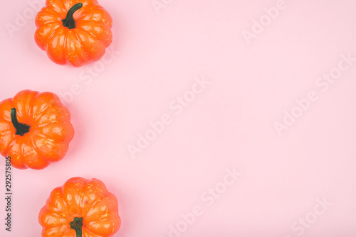 Pink background with pumpkins. Copy space for your text.