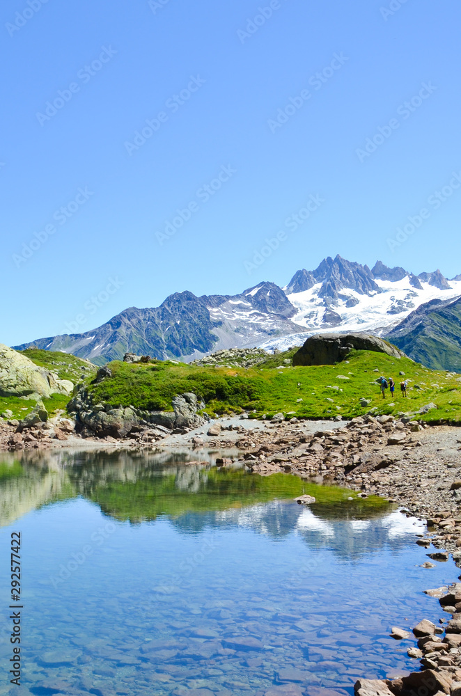 Stunning Lac de Cheserys, Lake Cheserys near Chamonix-Mont-Blanc in French Alps. Alpine lake with snow capped mountains in the background. France Alps, Tour du Mont Blanc trail. Nature background