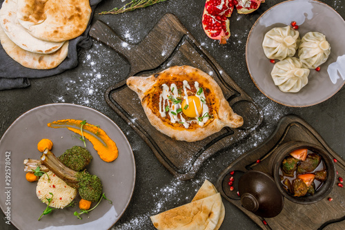 Georgian cuisine foodset from khachapuri, khinkali, chanachi, rack of lamb top view photo