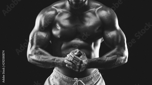 Black and white photo of male muscular body