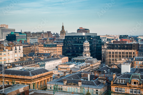 Fototapeta Naklejka Na Ścianę i Meble -  A rooftop view of the mixed architecture of old and new buildings in Glasgow city in late afternoon light, Scotland