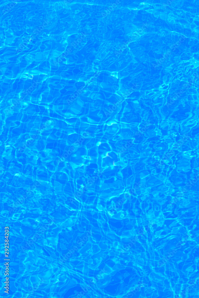The background of the water in the pool is blue, azure texture The background of the water in the pool is blue, azure texture