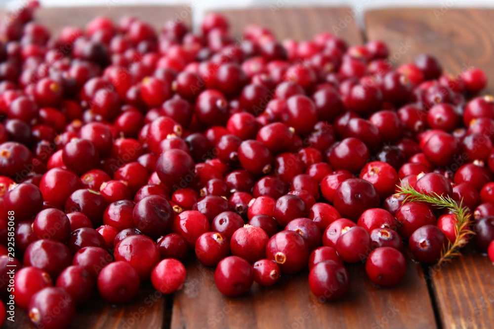 cranberries on wooden table cranberries on wooden table