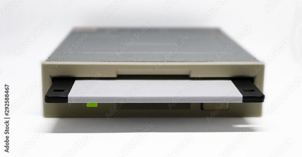 Floppy disk insert to floppy drive isolated on white background with clipping path Floppy disk insert to floppy drive isolated on white background with clipping path