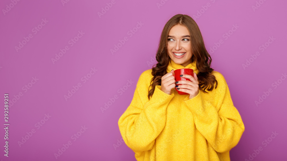 Cold autumn. Woman warming hands with cup Cold autumn. Woman warming hands with cup