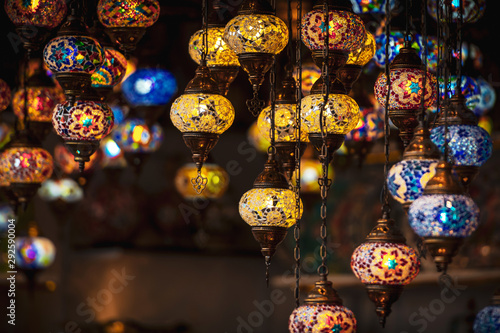 Oriental lamps in brass with colorful glasses during evening