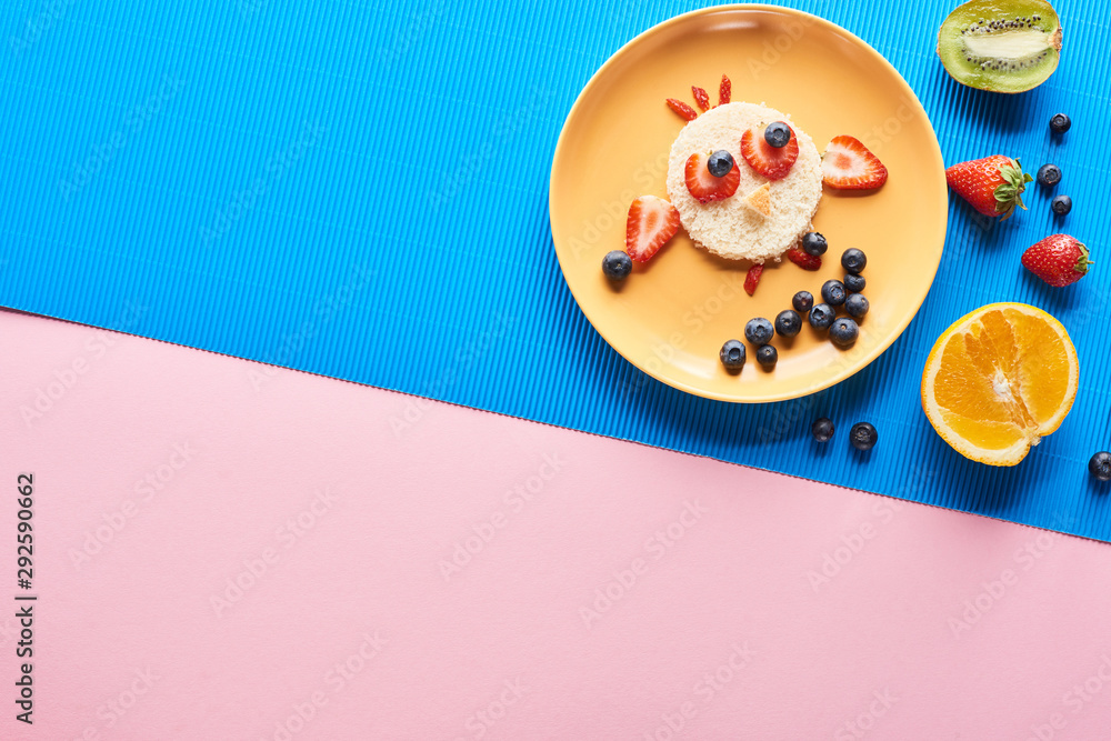 Fototapeta top view of plate with fancy animal made of food on blue and pink background