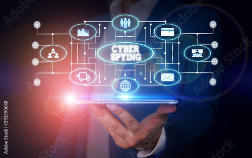 Conceptual hand writing showing Cyber Spying. Concept meaning form of cyber attack that steals classified or sensitive data Male wear formal suit presenting presentation smart device