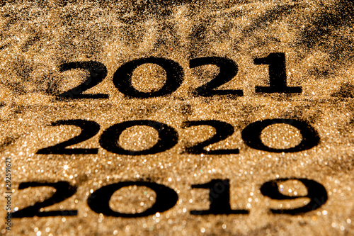 Beautiful sparkling Golden Numbers of 2019 to 2020 on black background for design, happy new year concept