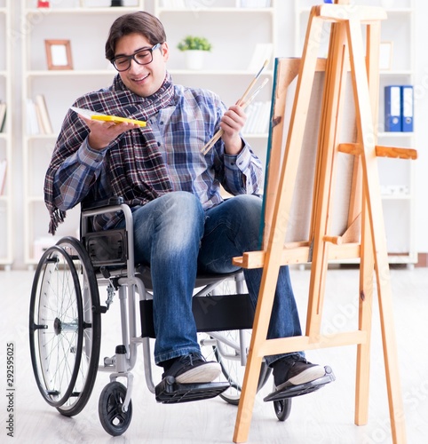 Disabled artist painting picture in studio