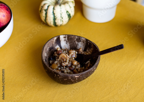 Traditional Turkish Dessert Asure, Ashura. Served in a coconut bowl.