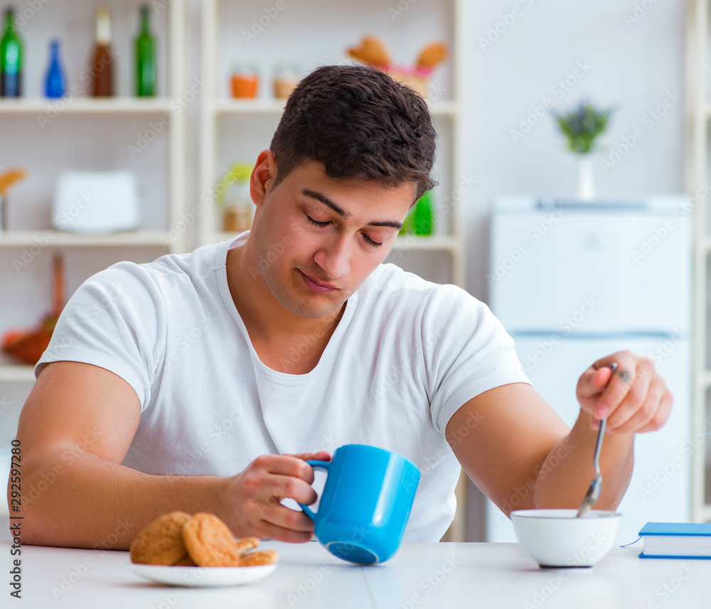 Man falling asleep during his breakfast after overtime work Man falling asleep during his breakfast after overtime work