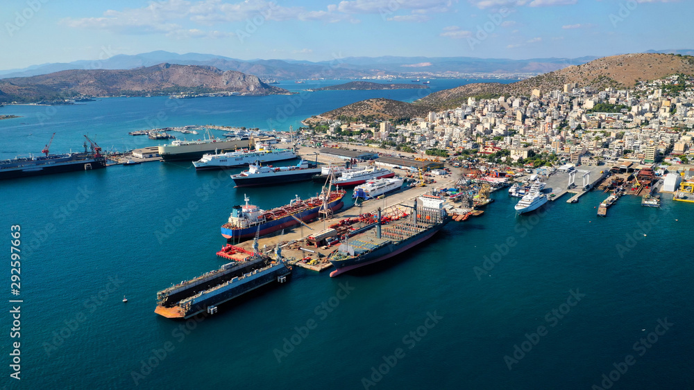 Aerial photo of industrial shipyard of Perama repairing small boats near Salamina island, Attica, Greece