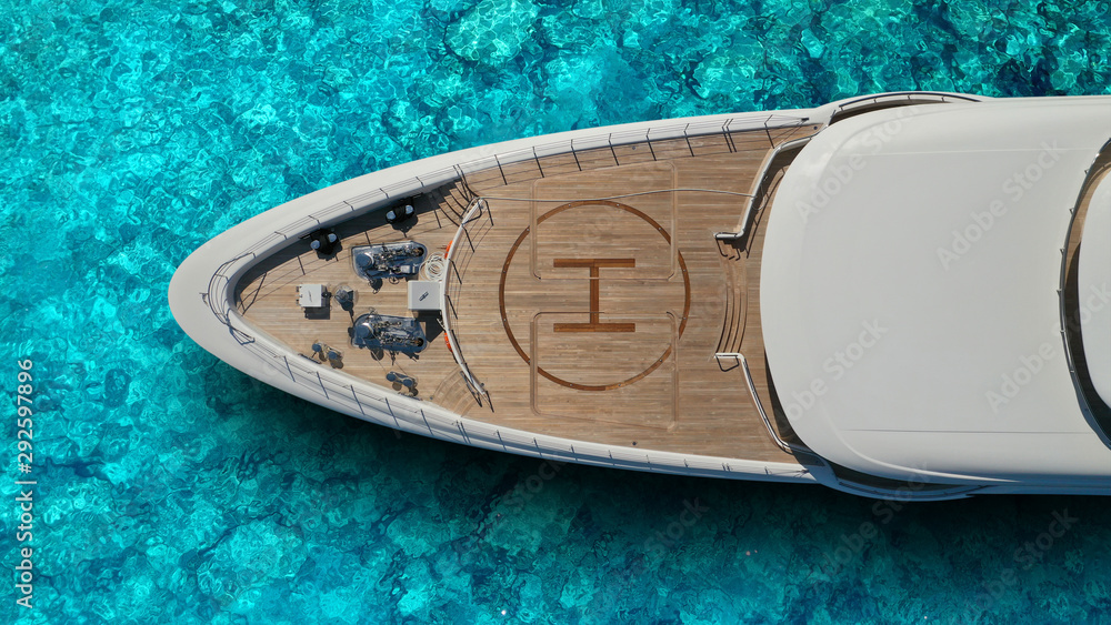 Aerial drone top view photo of large yacht nose - boat with helicopter  landing area docked in tropical exotic paradise with turquoise open sea  Photos | Adobe Stock