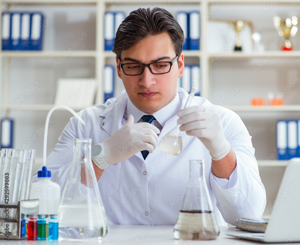 Young researcher scientist doing a water test contamination expe Young researcher scientist doing a water test contamination expe