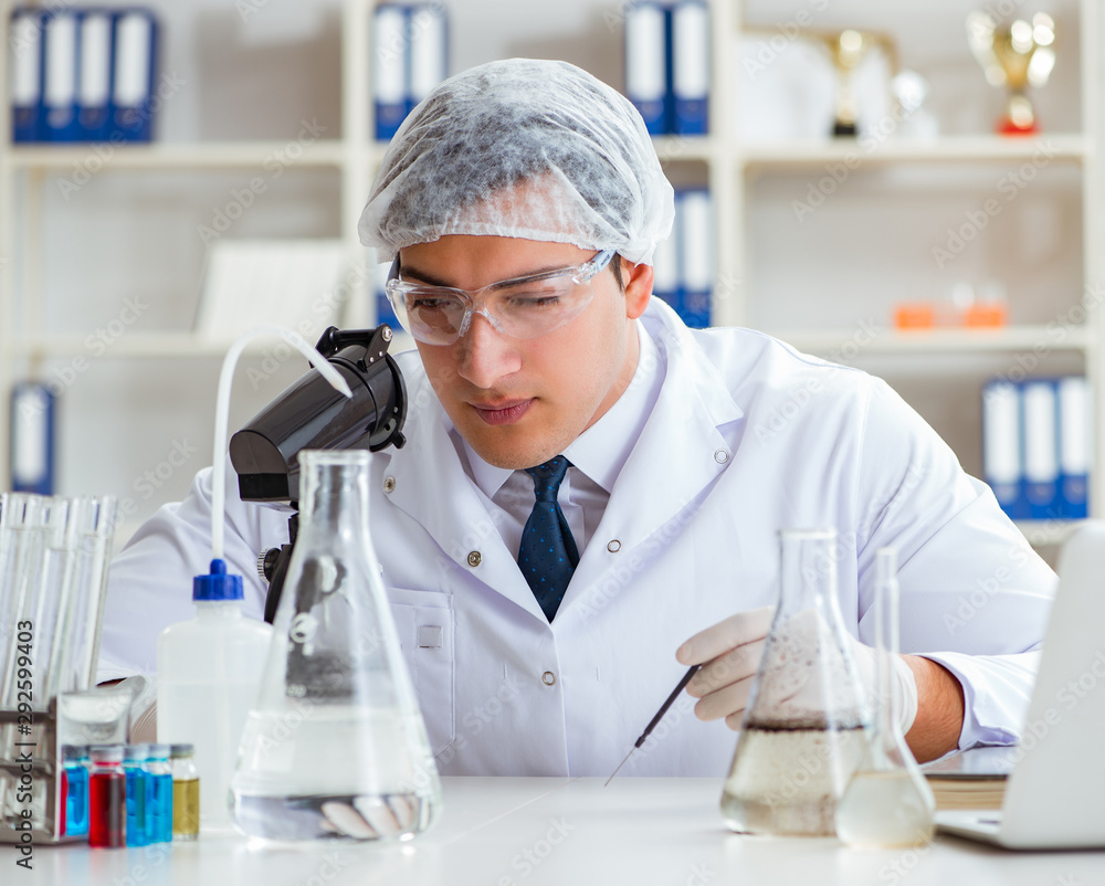 Young researcher scientist doing a water test contamination expe Young researcher scientist doing a water test contamination expe