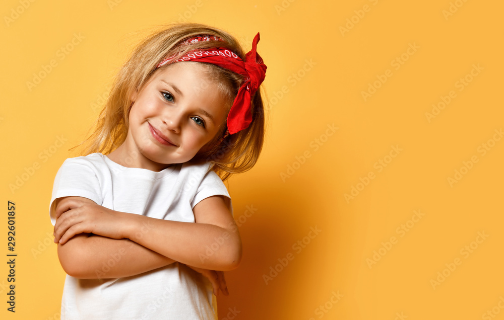 Little baby girl in white blank white t-shirt design red head band happy smiling on yellow