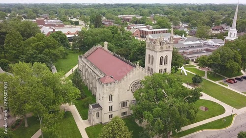 Aerial parallax of Dimnent Memorial Chapel at Hope College in Holland, Michigan. Drone circles slowly to the right above the building. photo