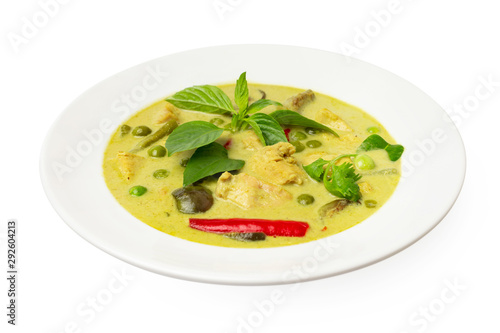 Closeup plate of thraditional thailand meal - green curry with chicken and eggplants served in a plate isolated at white background.