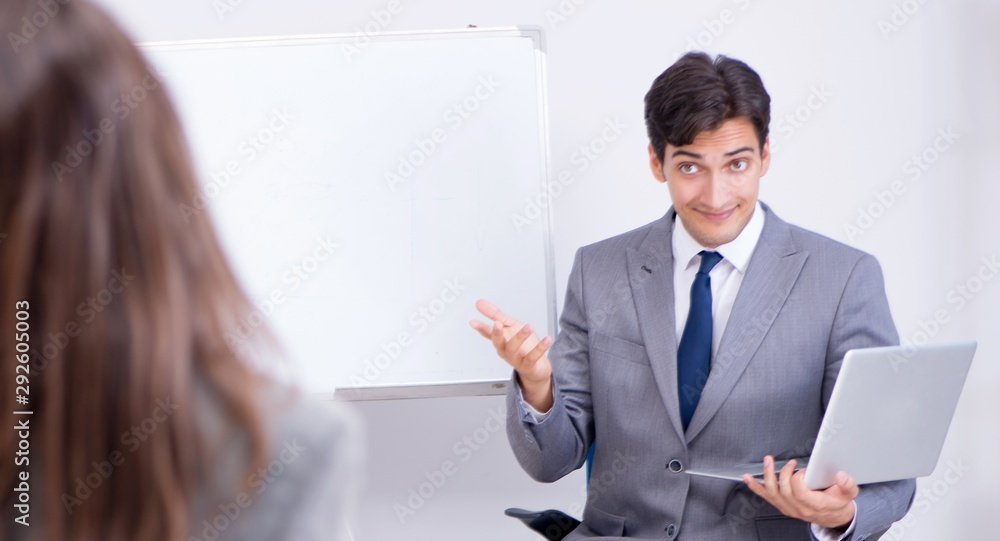 The business presentation in the office with man and woman The business presentation in the office with man and woman