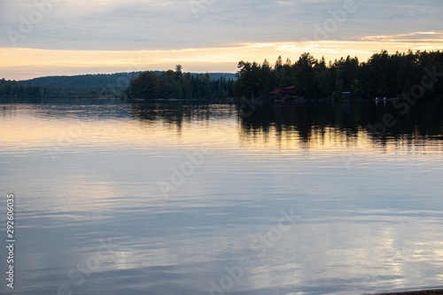 soft blue and coral reflections in the lake at sunset
