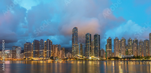 Panorama of skyline and Harbor of midtown of Hong Kong city at dusk © leeyiutung