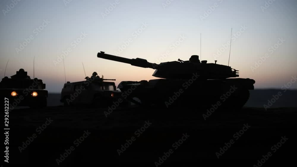 War Concept. Military silhouettes fighting scene on war foggy sky background at sunset. Armored vehicles with soldiers ready to attack. Artwork decoration. Selective focus War Concept. Military silhouettes fighting scene on war foggy sky background at sunset. Armored vehicles with soldiers ready to attack. Artwork decoration. Selective focus