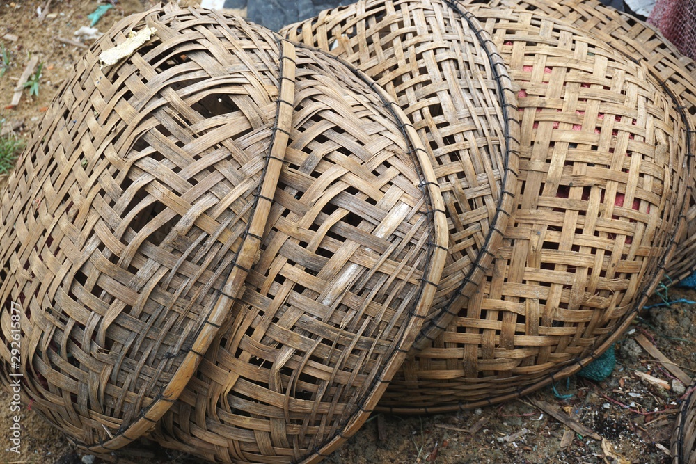 Closeup detail of pile of broken handwoven bamboo baskets in rural Southeast Asia