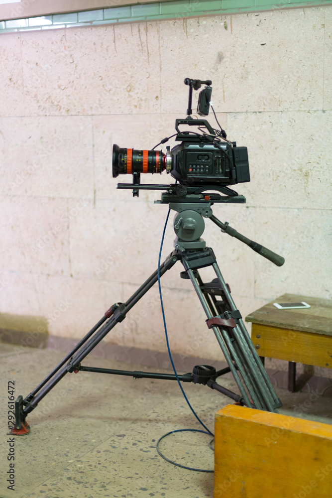 Process of filming. Big movie camera on a tripod. Stock Photo | Adobe Stock