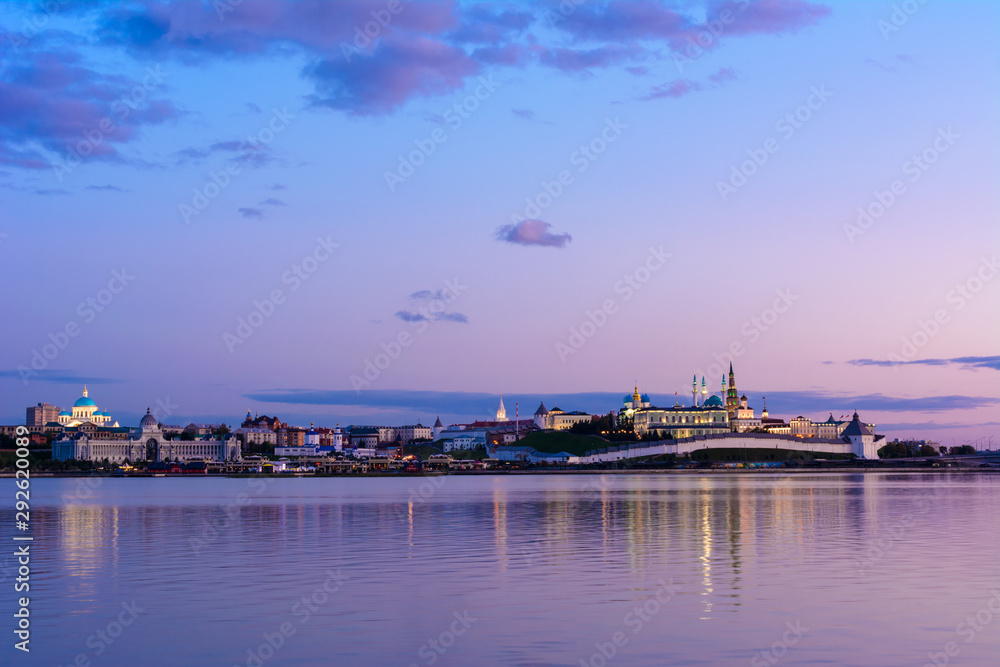 View of the Kazan Kremlin with Presidential Palace, Annunciation Cathedral, Soyembika Tower, Qolsharif Mosque from the embankment near the center family and marriage with the bright blue sky.