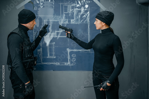 Принти на полотні Two robbers working on a plan to rob the vault