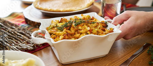 baked stuffing in casserole dish at thanksgiving dinner