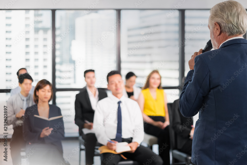 Speaker talking in seminar with many of audiences for business meeting for key of success Speaker talking in seminar with many of audiences for business meeting for key of success