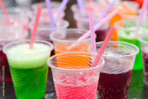 Colorful soft drink in plastic cup